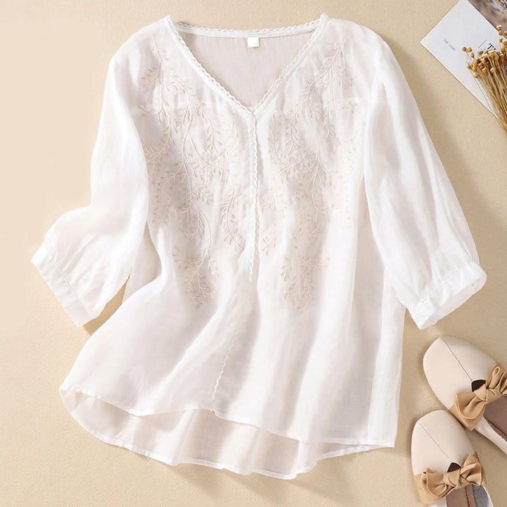 Delicate nature-inspired embroidered top, women's comfortable summer blouse, versatile and chic apparel for any occasion.