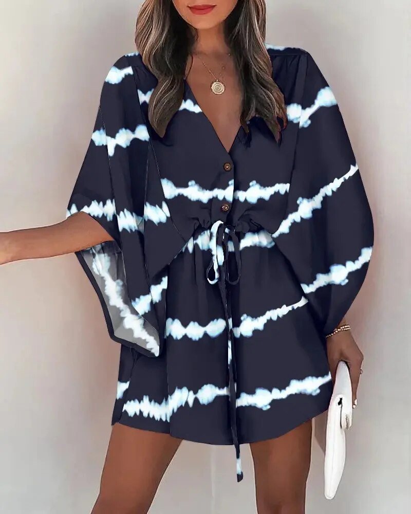 Close-up of V-neckline and delicate ruffle sleeves on a flowing summer dress for women