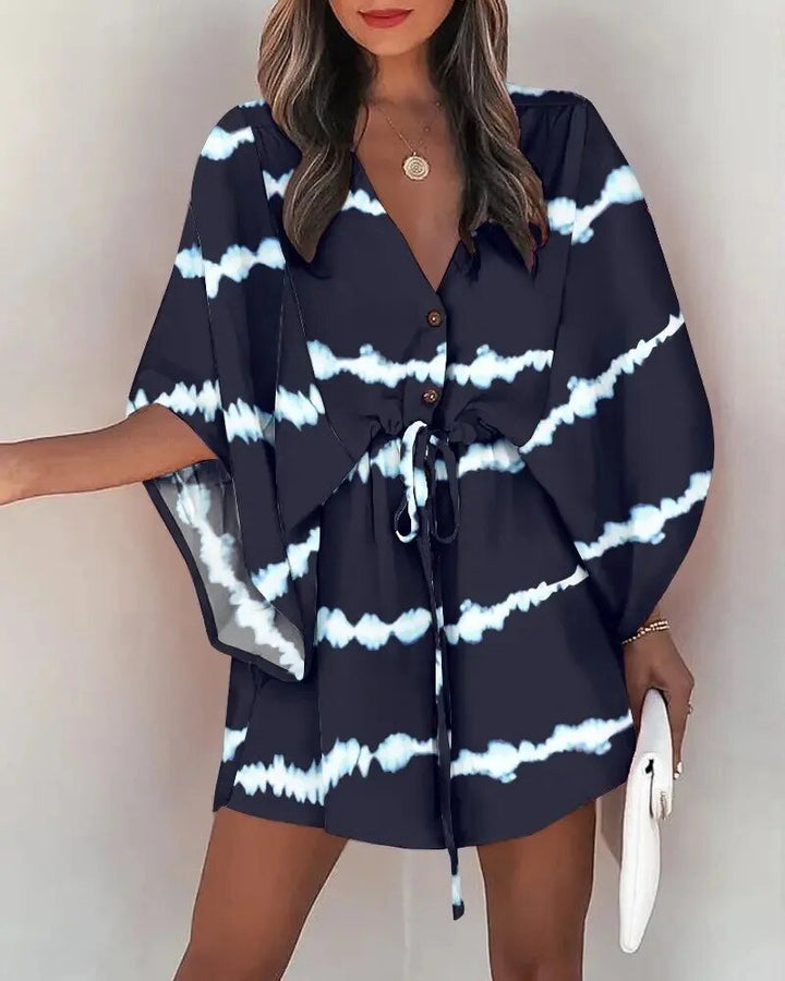 Close-up of V-neckline and delicate ruffle sleeves on a flowing summer dress for women