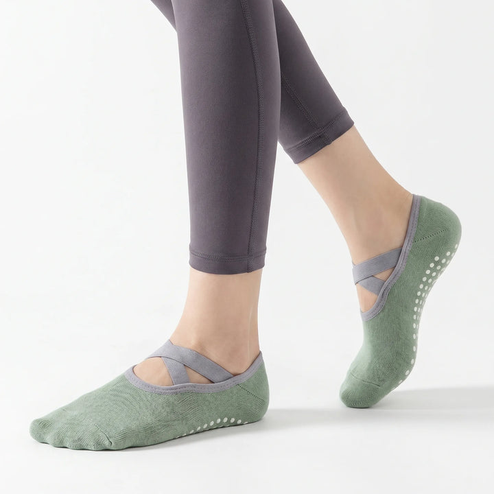 Green grip socks for women, offering non-slip stability for yoga, dance & studio fitness.