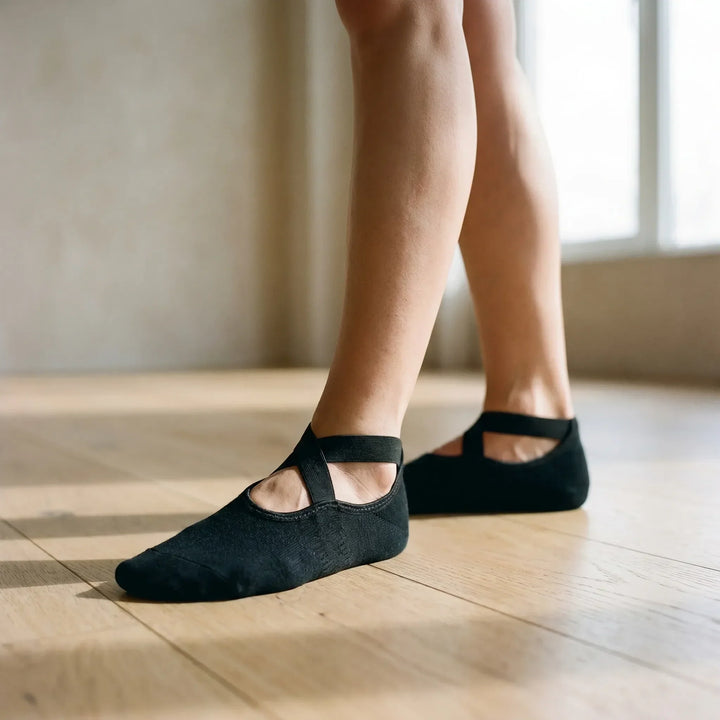 Women's non-slip textured yoga socks for enhanced grip during pilates & studio workouts.