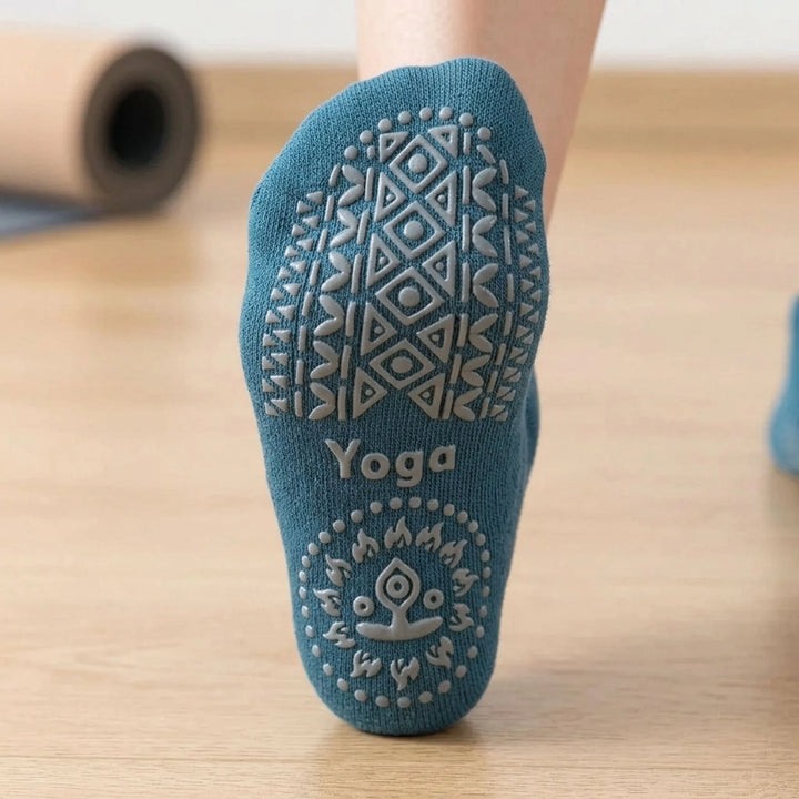 Black non-slip textured studio socks for women, offering superior grip for yoga, pilates & barre.