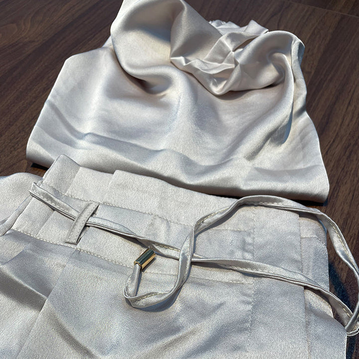 Woman in Nora Summer Loungewear Set, enjoying a relaxed moment in a chic, comfortable two-piece outfit.