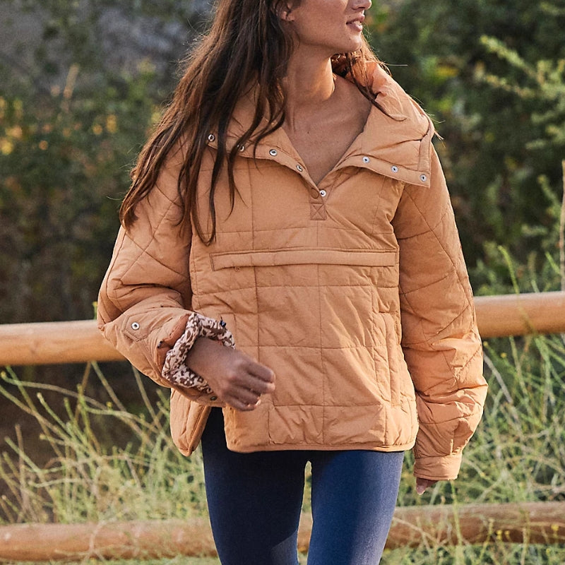 Women's Noria pullover puffer jacket, warm & water-resistant, perfect for winter and fall travel.