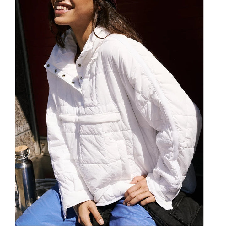 Detail of water-resistant fabric on Noria women's pullover puffer jacket, durable & warm.