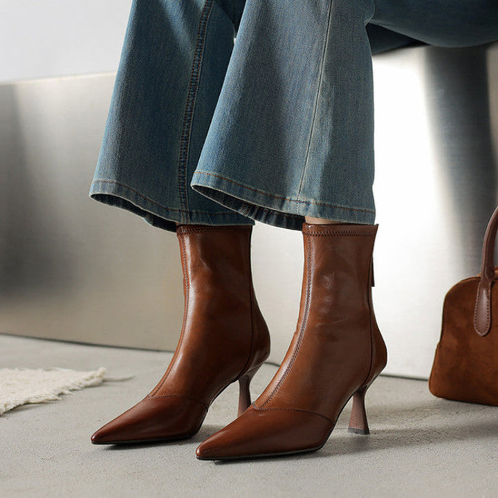 Versatile brown NOVA ankle boots with sophisticated pointed toe heels. Perfect stylish footwear for women.