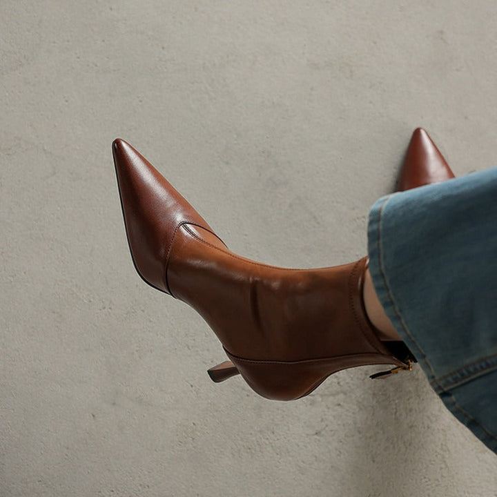 Stylish Women's NOVA pointed toe ankle boots with heels. Modern chic fashion footwear for confident women.