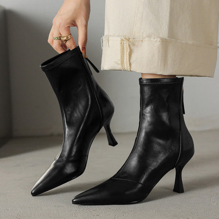 Brown NOVA pointed toe ankle boots, ideal for stylish women. Versatile heels for any chic outfit.