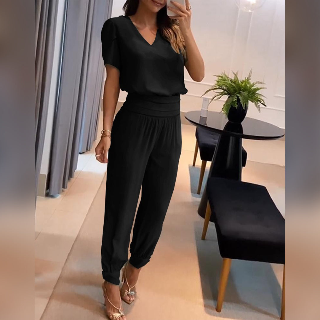 Women's Nova printed jumpsuit with elegant design. Stylish wide-leg, V-neck, perfect for versatile fashion.