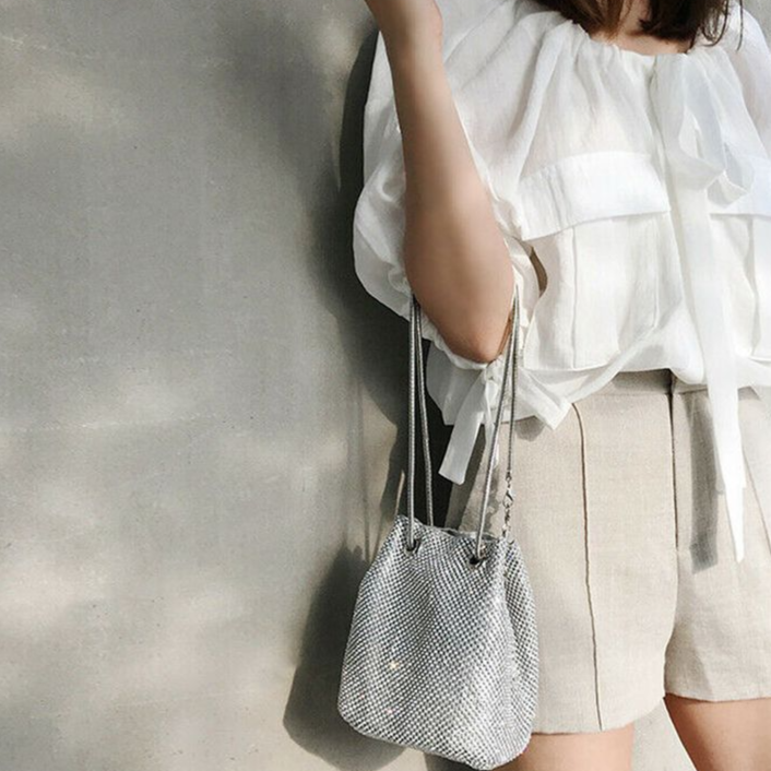 Black Nova Shoulder Bag. Elegant women's structured handbag, a versatile black luxury accessory.