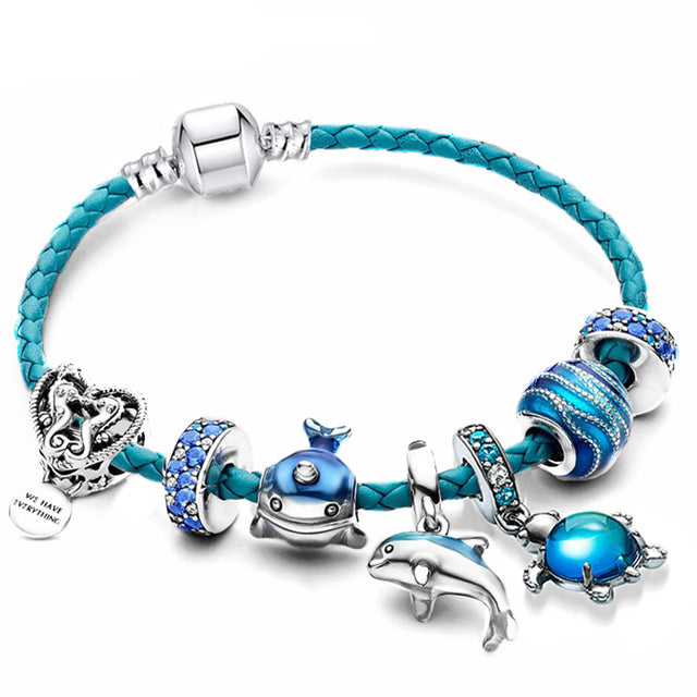 Nautical women's leather bracelet with sterling silver ocean-inspired charms; ideal for everyday sea-themed style.