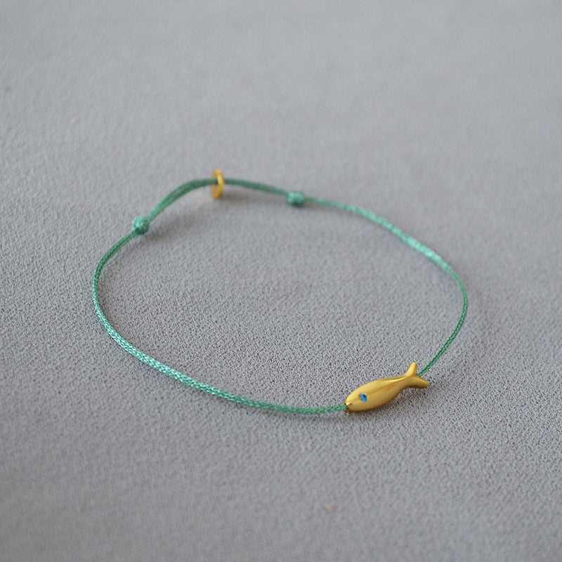 Stylish women's Ocean Dream armband, Livia design, depicting goldfish, perfect for a casual yet elegant look