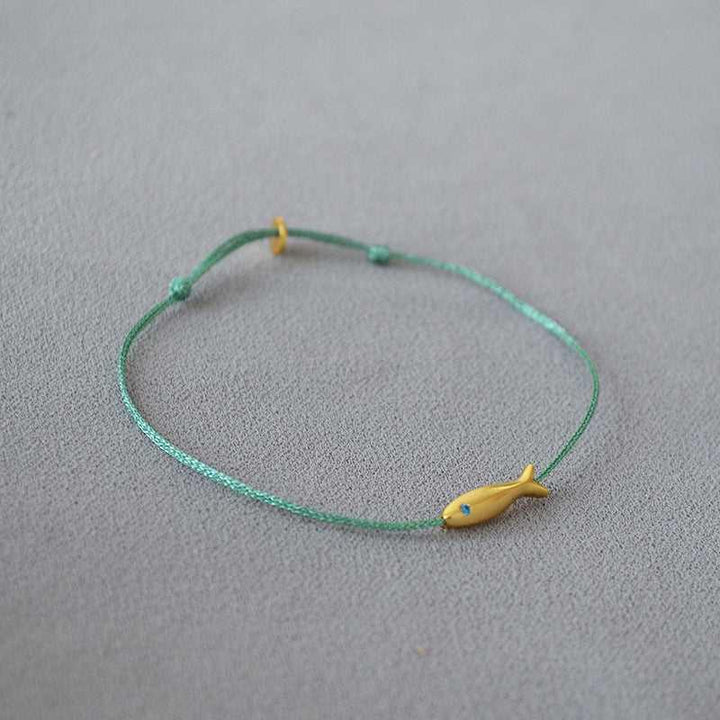 Stylish women's Ocean Dream armband, Livia design, depicting goldfish, perfect for a casual yet elegant look