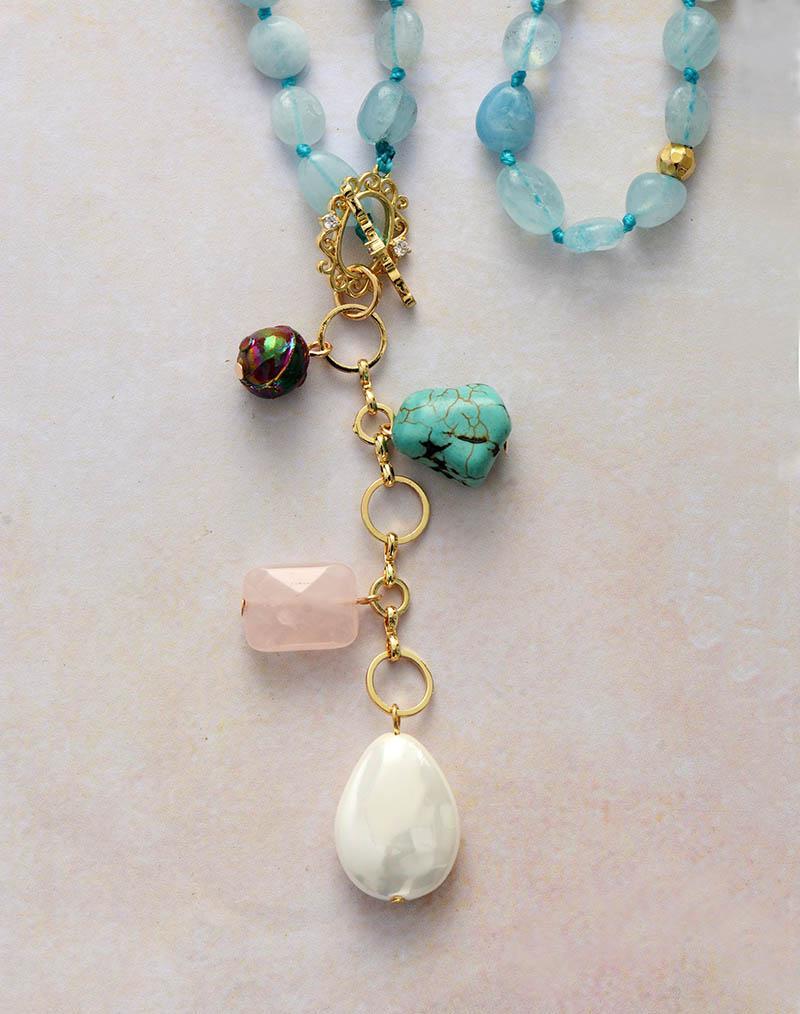 Elegant women's Ocean Drop healing stone mala necklace with aquamarine, turquoise, rose quartz beads.