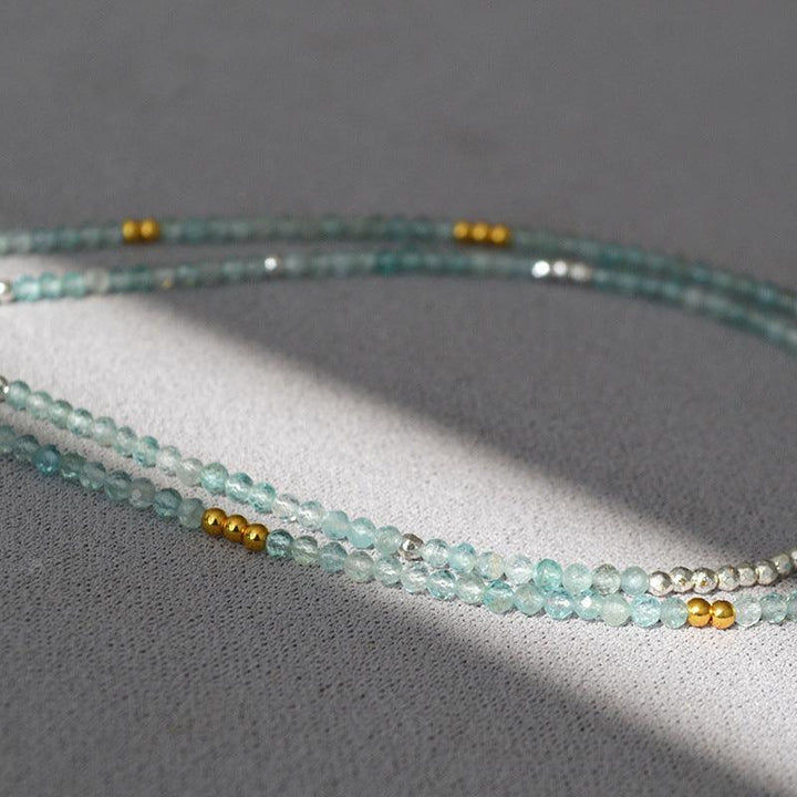 Mirelle's Ocean Whisper necklace, a beautiful blue bead clavicle chain for women.