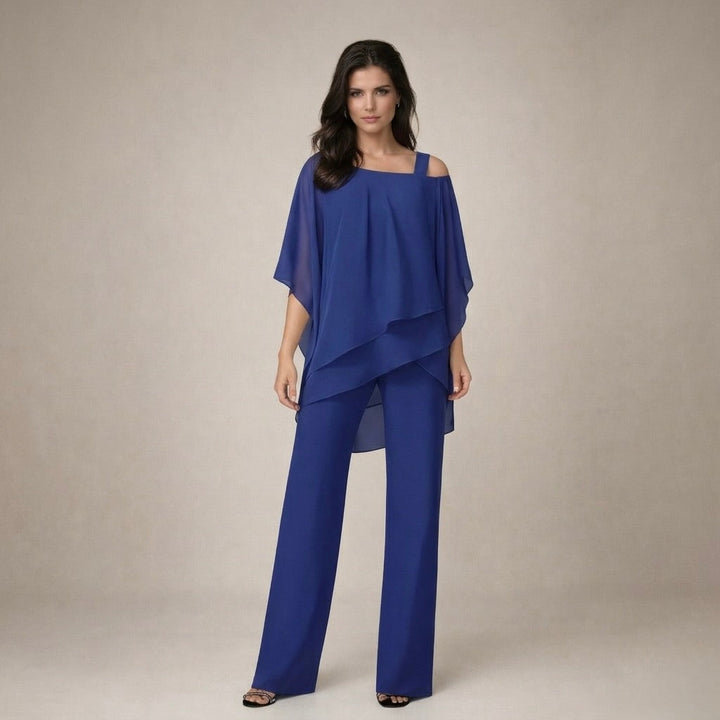 Elegant women's off-shoulder top and wide-leg pants. Stylish two-piece matching set for a chic summer look.