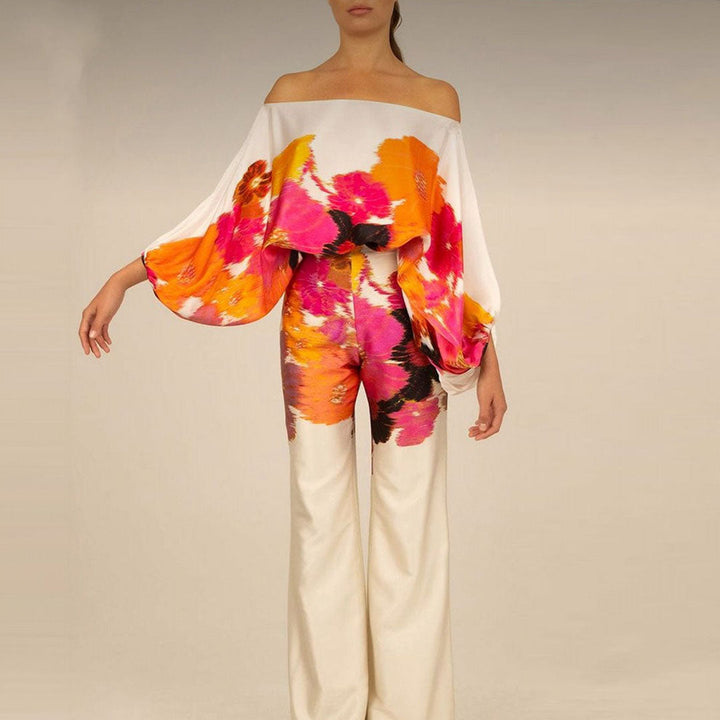 Elegant women's one-shoulder printed co-ord set featuring flowing wide-leg pants. A chic two-piece outfit.