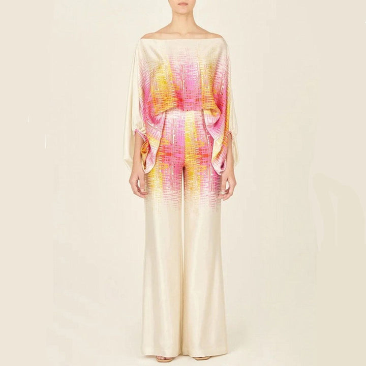 Stylish women's one-shoulder top and wide-leg pants co-ord set. Vibrant print, comfortable matching outfit.