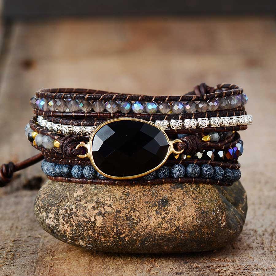 Model wearing Onyx Moonlight Protective Wrap Bracelet, a stylish and healing leather bracelet for women