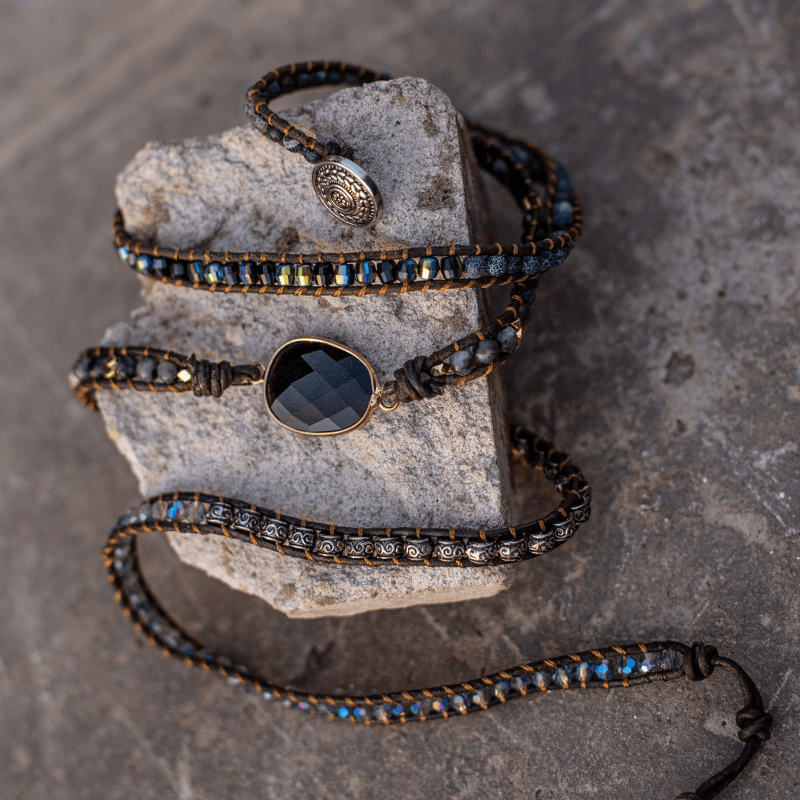 Elegant women's onyx wrap bracelet, a spiritual accessory with protective gemstone properties