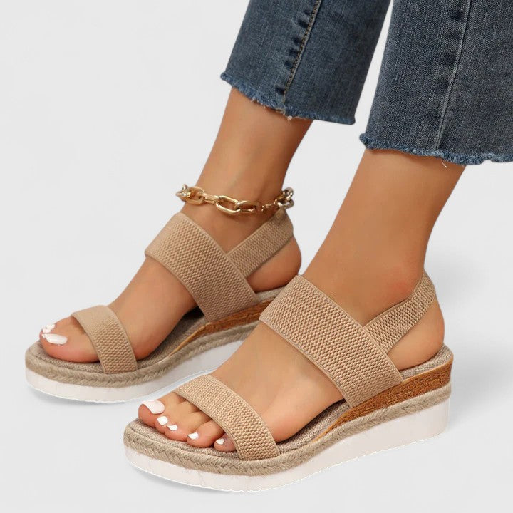 Slip-on women's orthopedic wedge sandals. Open-toe design with arch support for easy, comfortable summer relief.