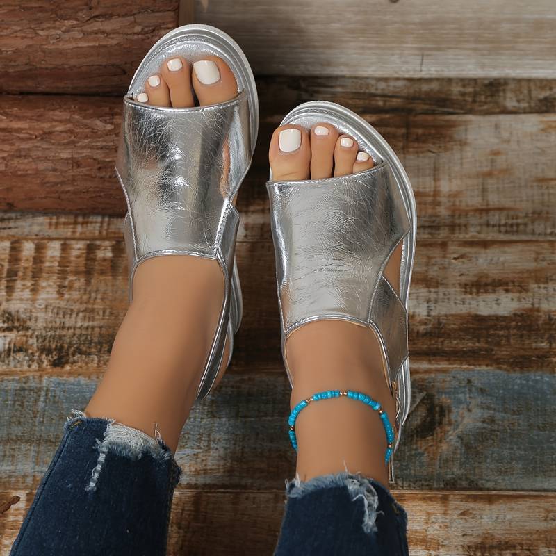 Fashionable women's open-toe platform wedge sandals, essential footwear for warm weather.