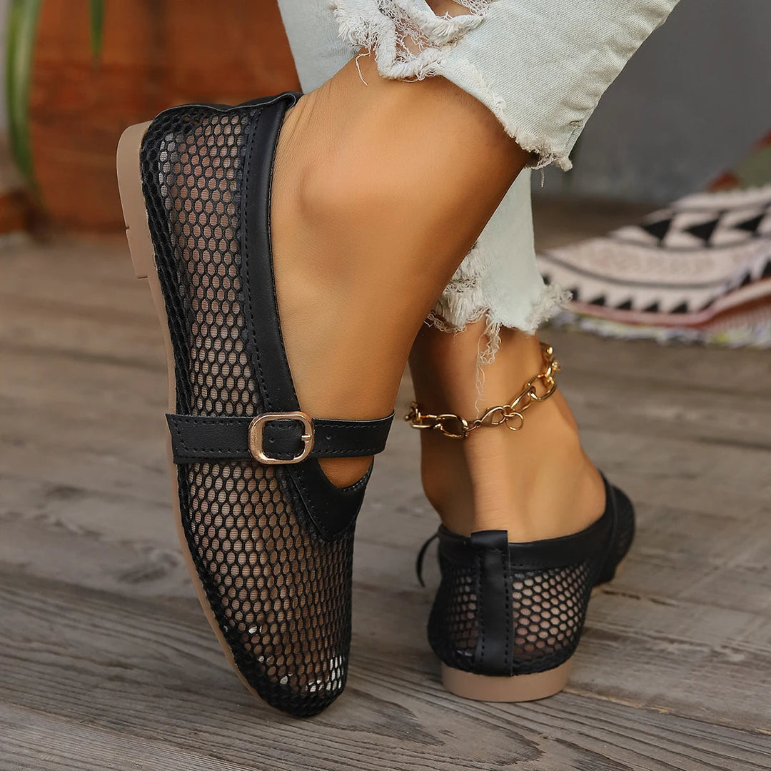 Breathable open-weave Mary Jane flats for women. Slip-on design provides lightweight, casual comfort.