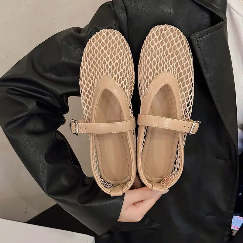 Chic women's open-weave Mary Jane flats, offering breathable comfort. Perfect casual or office footwear.