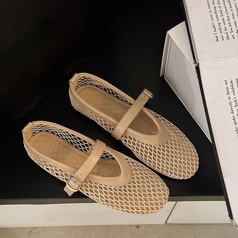 Everyday comfort with women's open-weave Mary Jane flats. Breathable, adjustable strap, perfect for summer.