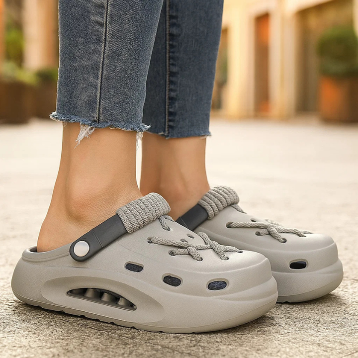 Stylish women's Orbit Laced Clogs, ideal slip-on footwear for vacation & daily comfort.