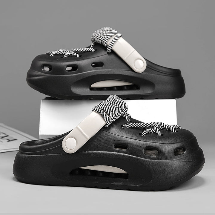 Pair of Women's Orbit Laced Clogs, showcasing unique lace detail and cushioned comfort sole.