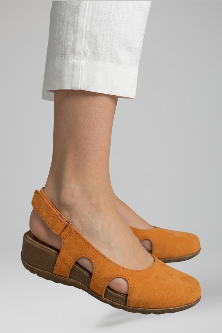 Woman wearing stylish orthopaedic comfort sandals with adjustable straps, perfect for summer daily wear.