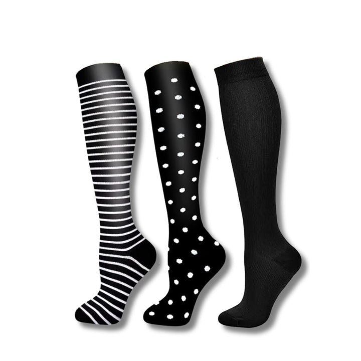 Athletic recovery compression socks for women, promoting faster muscle recovery & leg support.