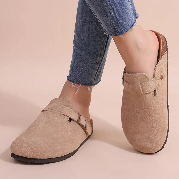 Slip-on women's comfort slippers with orthopaedic features for daily foot support & all-day comfort at home.