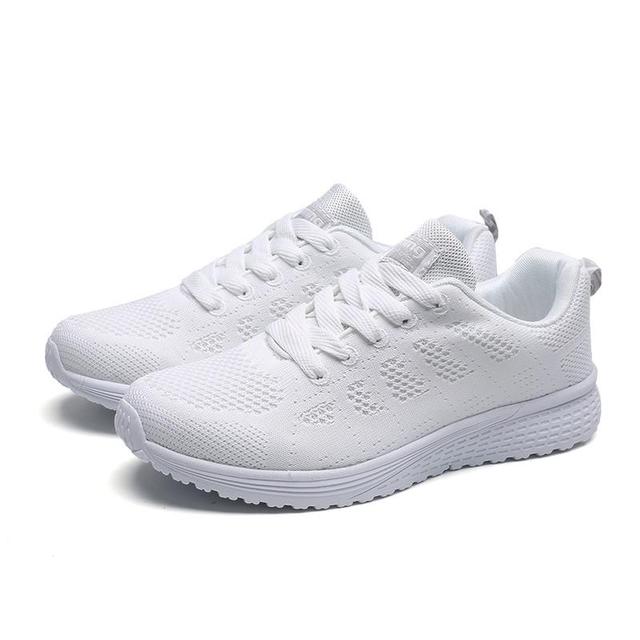 Athletic women's orthopedic running shoes, designed for comfort, support, and lightweight performance.