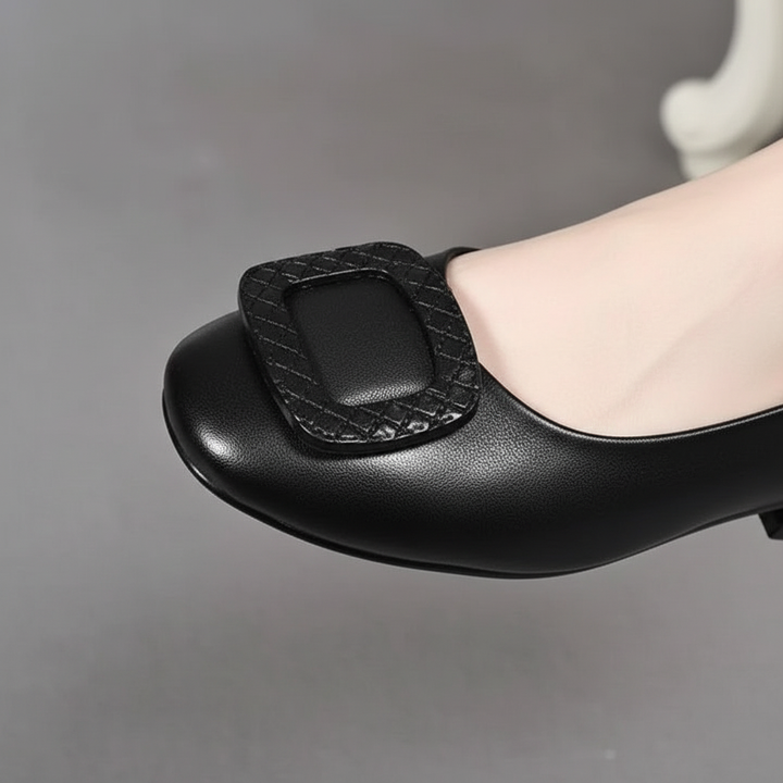 Stylish women's leather flats with orthopedic support, small heel, perfect for casual or business attire.