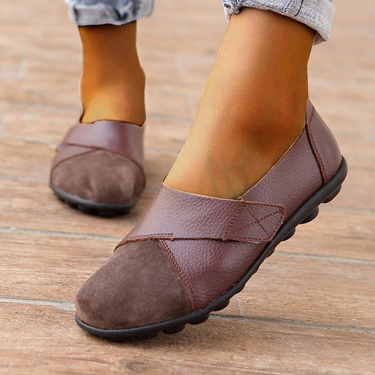 Genuine leather casual loafers for women, comfortable slip-on style, designed for foot support.