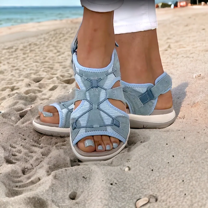 Women's orthopedic comfort sandals with adjustable crisscross straps. Stylish summer footwear for everyday walking.