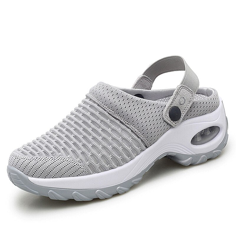 Supportive women's orthopedic sandals, ideal for arch support & breathable comfort on walks.