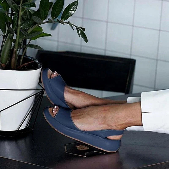 Cushioned women's comfort sandals with a low heel, providing orthopedic support for summer footwear.