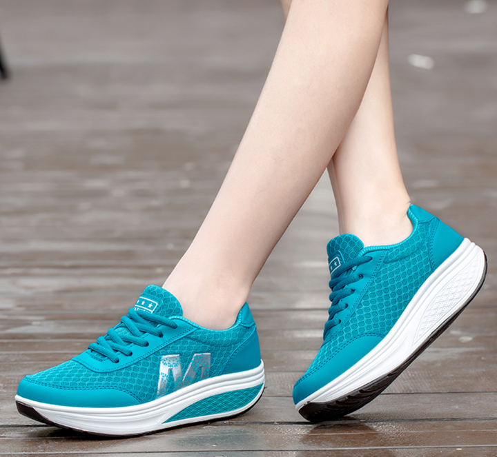 Women's walking sneakers with posture corrective technology, providing superior foot support for active women.