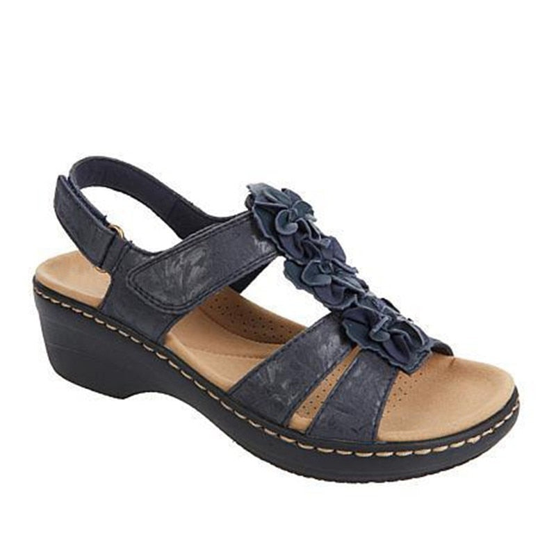 Retro gladiator sandals with orthopedic features, elegant floral embellishments, secure ankle strap, low wedge heel