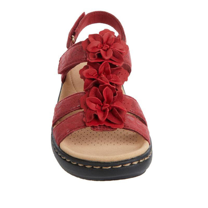 Women's orthopedic gladiator sandals, close-up of floral detailing on straps, light brown leather, casual summer style