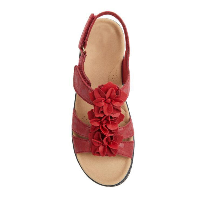 Pair of women's orthopedic gladiator sandals, floral accents, wedge heel, ready for summer outings and comfort