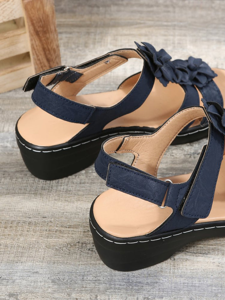 Back view of women's orthopedic gladiator sandals, comfortable wedge, floral details
