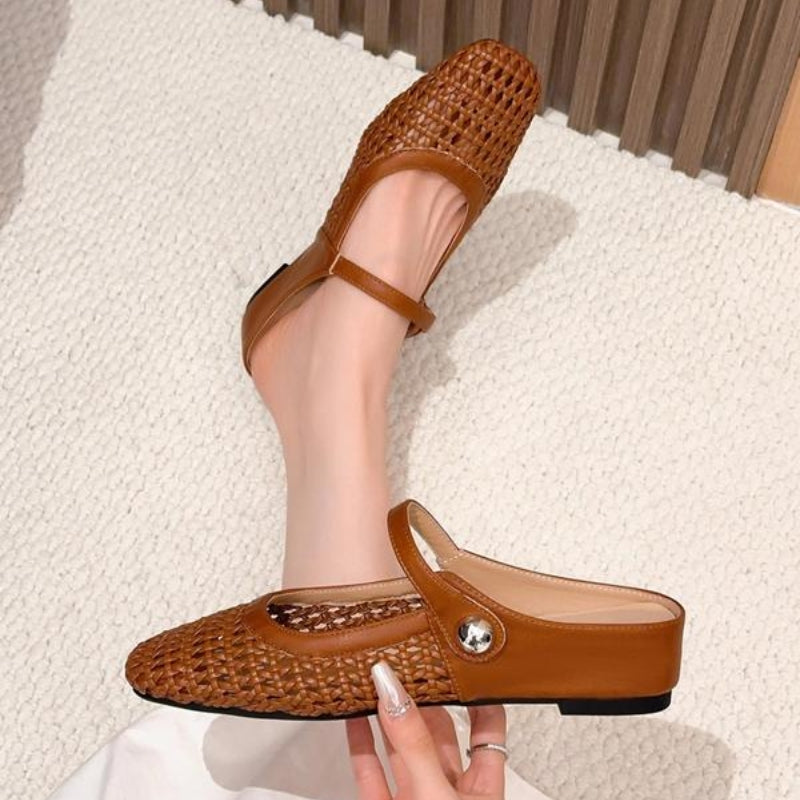 Women's orthopedic mule flats from above, emphasizing breathable material & secure, comfortable design.