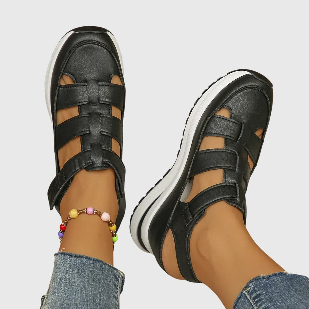 Close-up: Orthopedic women's sandals, detailed adjustable arch support for superior comfort.
