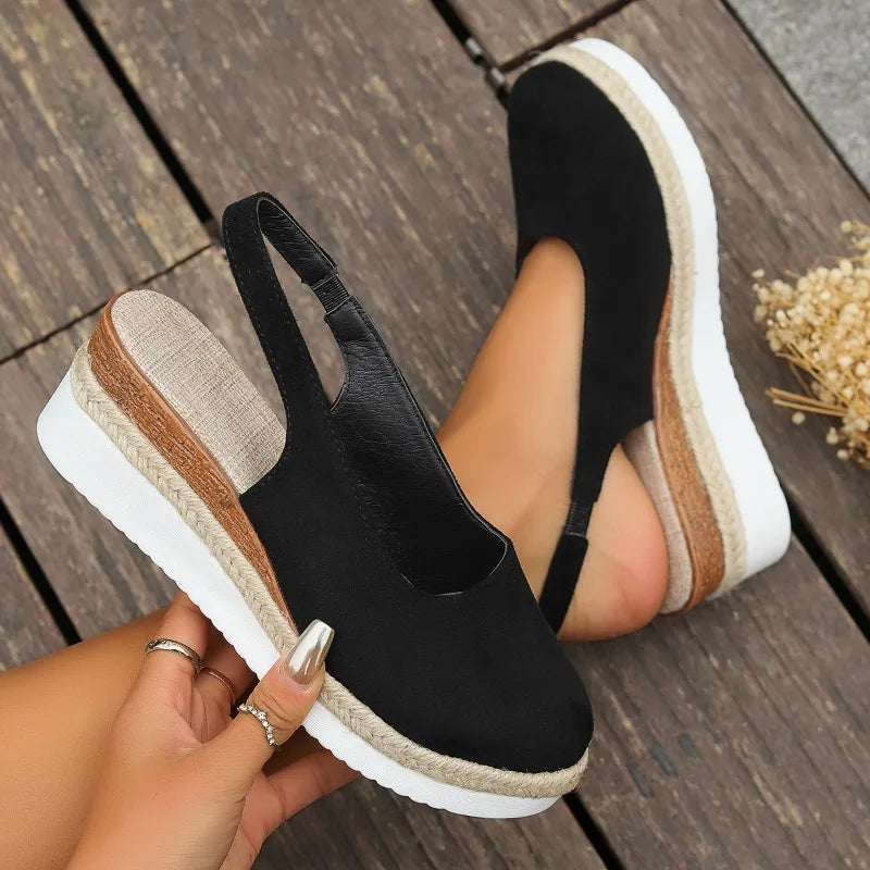 Detail shot of women's comfort sandals: flexible straps & soft, cushioned footbed designed for all-day wear.