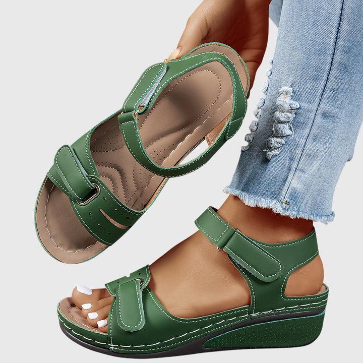 Comfortable women's crystal sandals, designed with arch support & slip-resistant sole for walking.