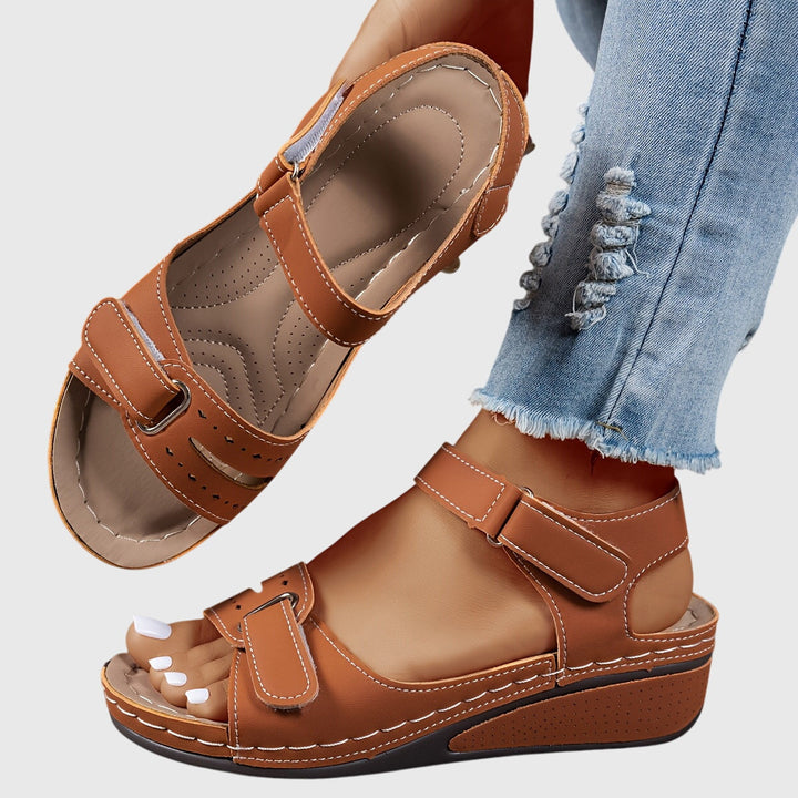 Orthopedic women's sandals with sparkling crystals, providing essential arch support & all-day comfort.